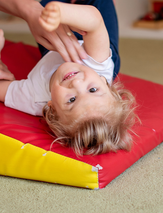 a minimalist line drawing of a person with a bun hairstyle and a welcoming gesture representing support or assistance related to three key elements of community engagement
